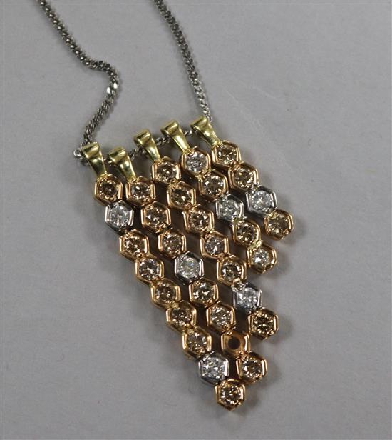 Five graduated modern gold and two colour diamond set line pendants, mounted on a silver chain, longest 4cm.